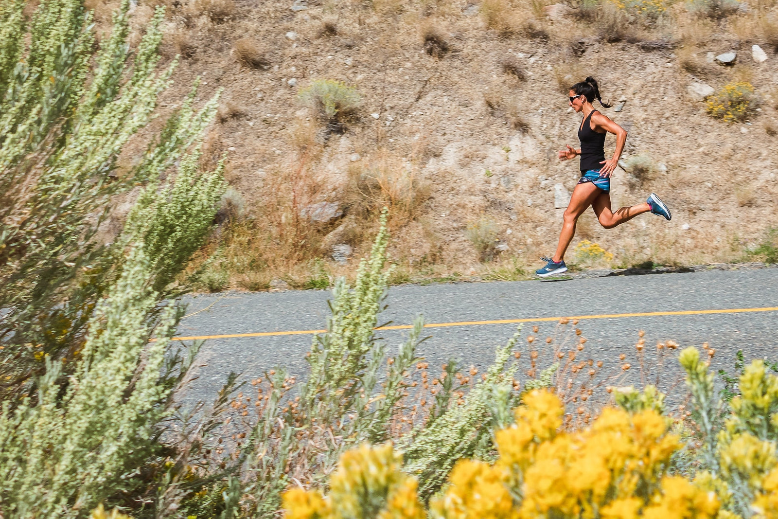 Woman running down a rural road