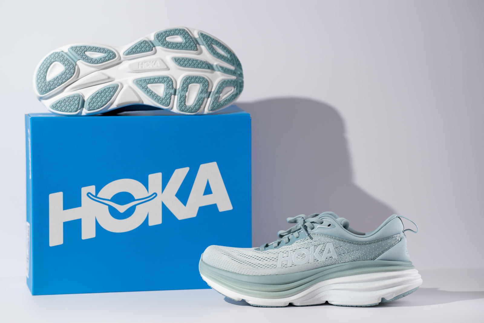 A new pair of Hoka running shoes with their box for a beginner’s guide to Hoka