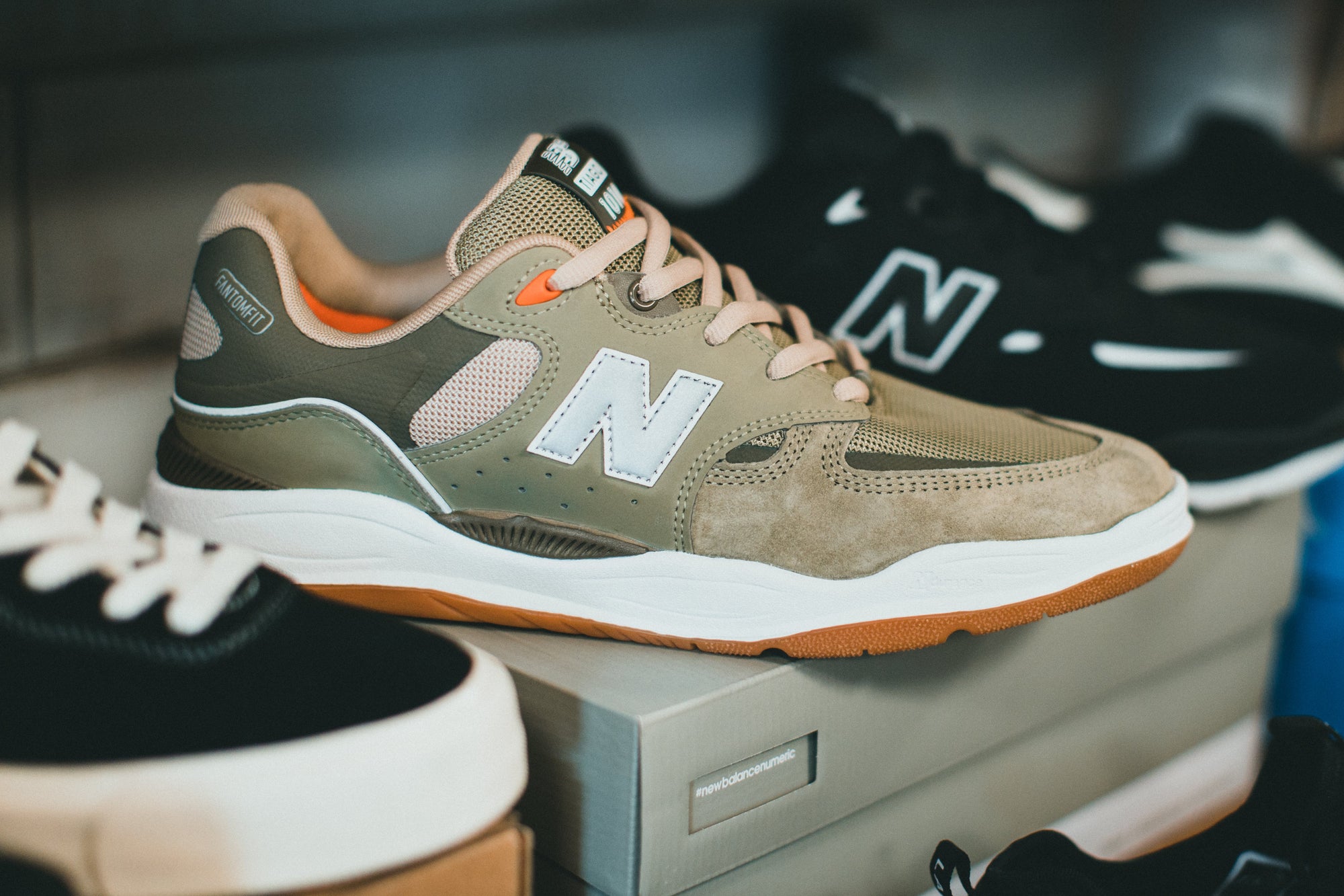 Assorted New Balance trainers featuring diverse styles for various preferences, reflecting the brand's dedication to comfort and fashion.