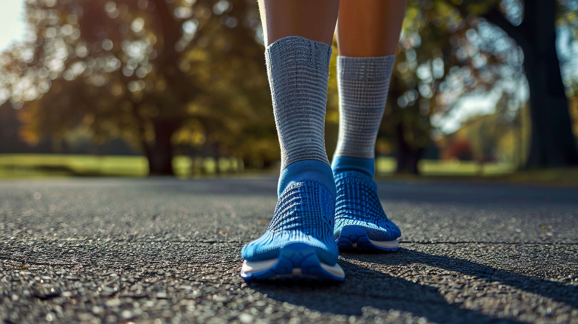 Walking man comfortably wearing grey calf-length compression socks