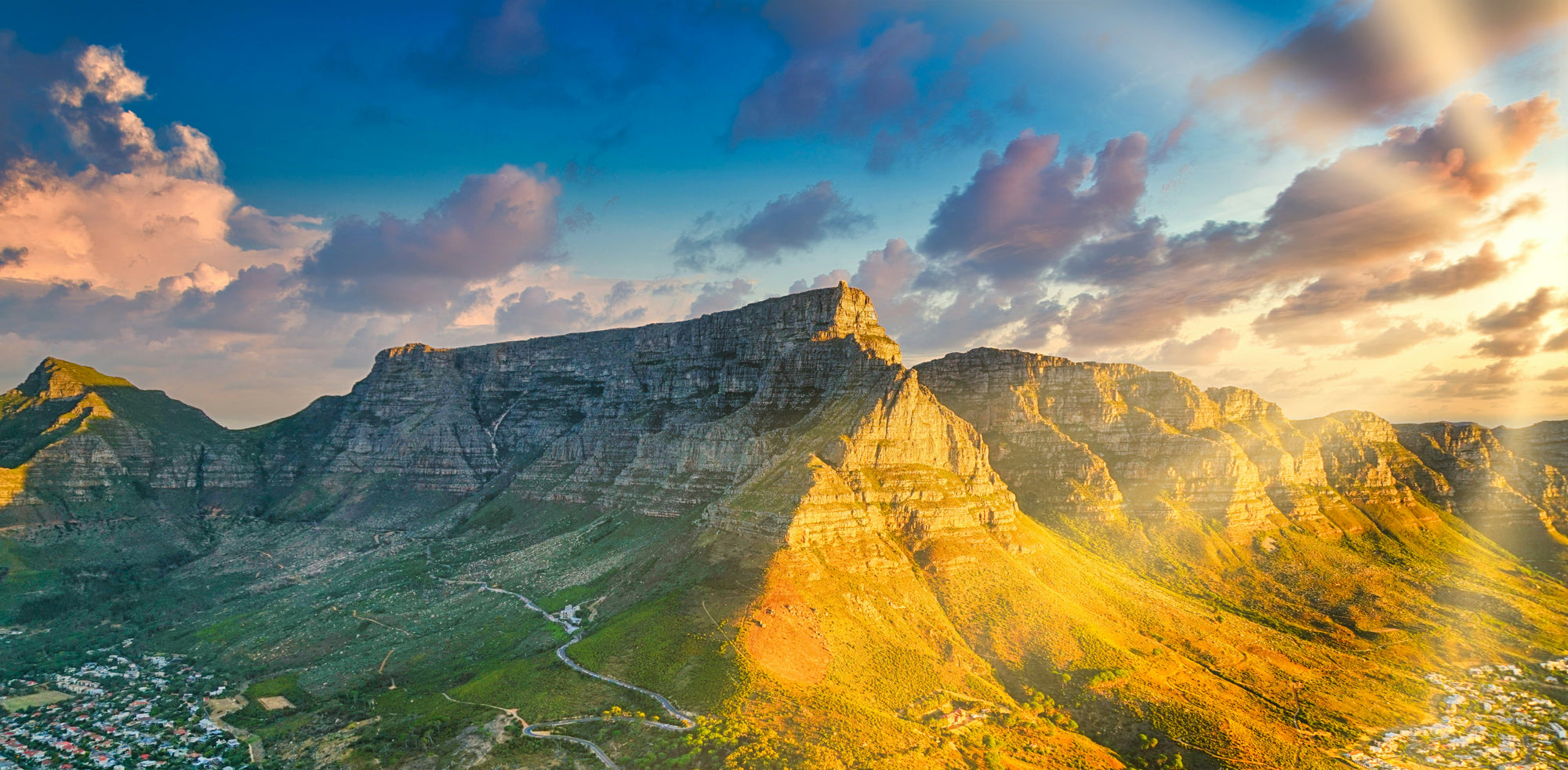 A wide view of the Table mountain with the best running routes during a sunset