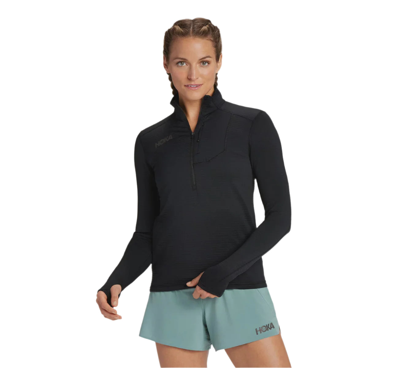 Woman wearing a black long-sleeve Hoka zip-up top women's jacket from athlete's foot.